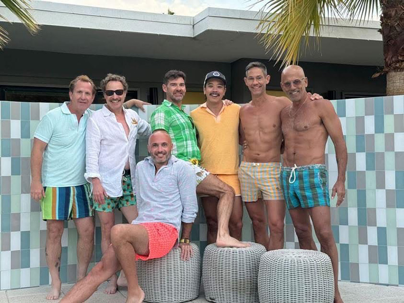 Group of men dressed in stylish resortwear