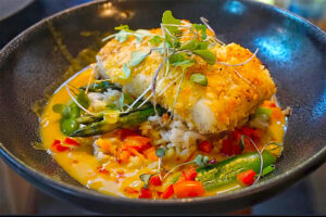 Artfully presented appetizer of seafood and fresh produce at Michelin Star restaurant